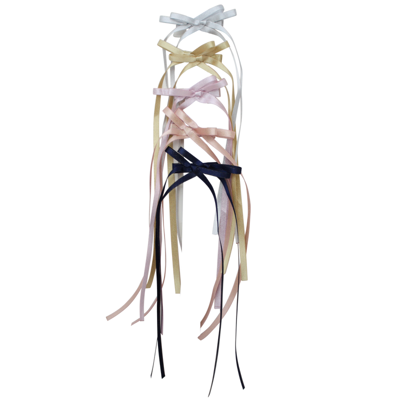 Skinny satin headbands with long ribbon bows in white, cream, blush, pink, and navy